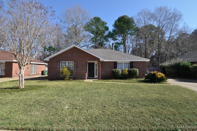 ranch-style home with a front lawn