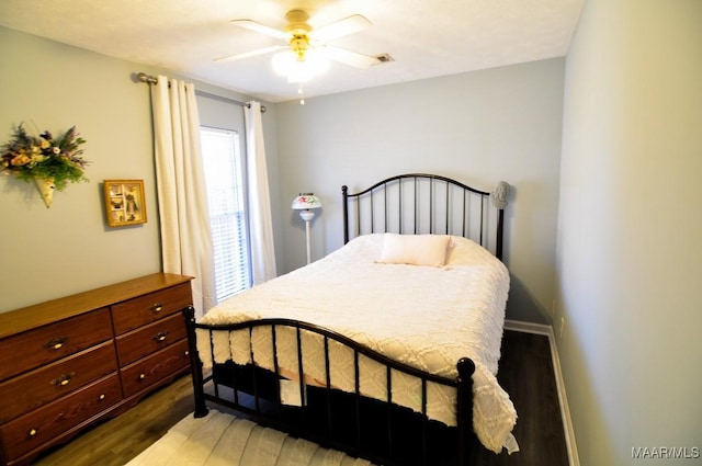 bedroom featuring hardwood / wood-style floors and ceiling fan