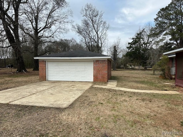 garage featuring a lawn