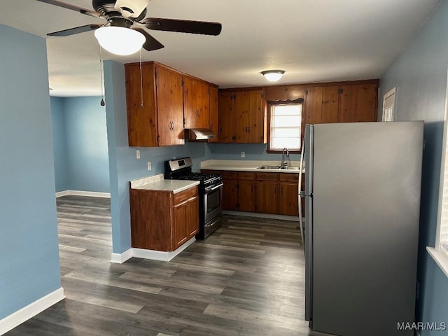 kitchen featuring sink, stainless steel appliances, and dark hardwood / wood-style floors