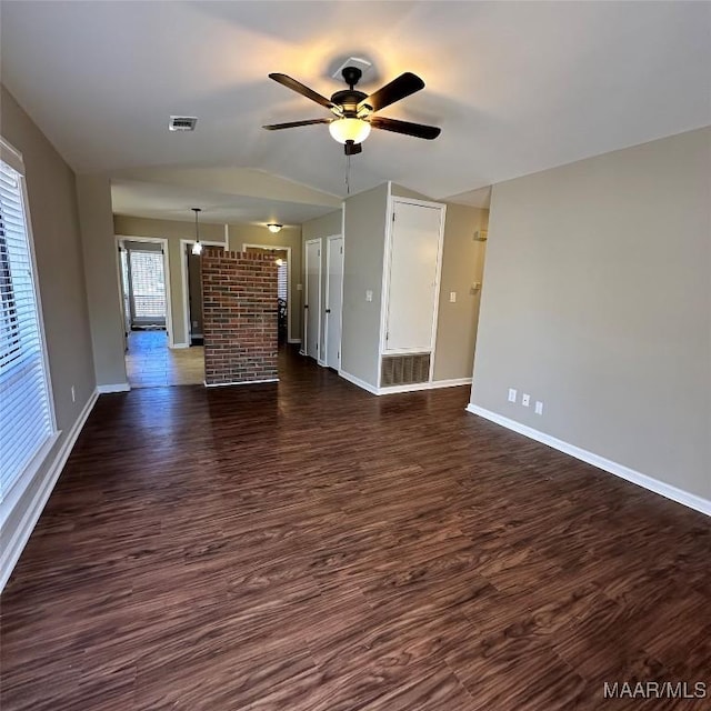 unfurnished living room with vaulted ceiling, dark wood-type flooring, and ceiling fan