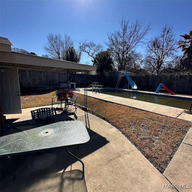 view of patio / terrace featuring a fenced in pool