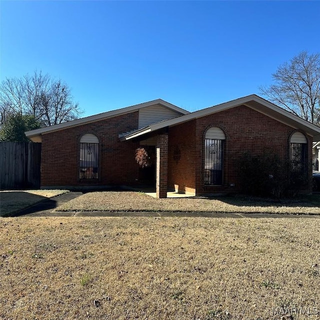 ranch-style home with a front yard