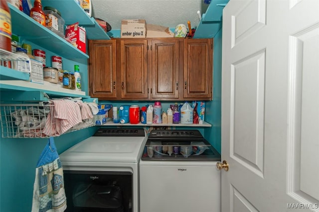 laundry room featuring cabinets, independent washer and dryer, and a textured ceiling