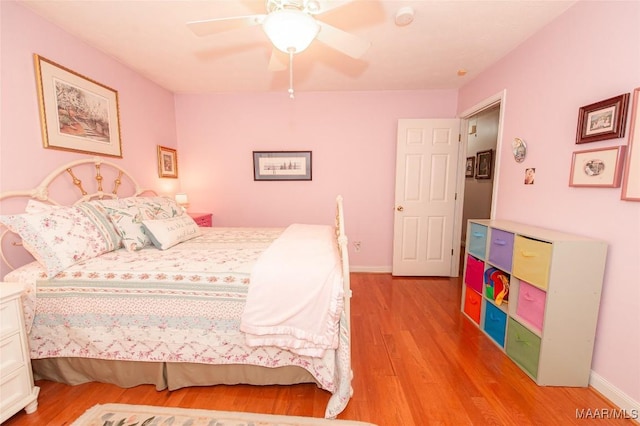 bedroom with ceiling fan and light wood-type flooring