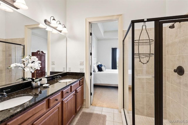 bathroom with tile patterned flooring, vanity, crown molding, and an enclosed shower