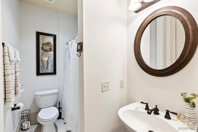 bathroom with sink and toilet