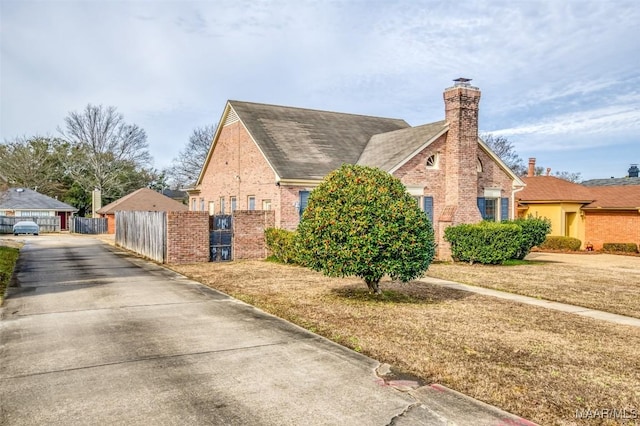 view of side of property with a lawn