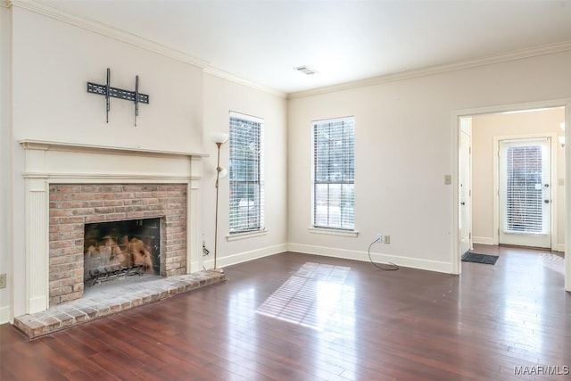 unfurnished living room with crown molding, baseboards, and hardwood / wood-style floors