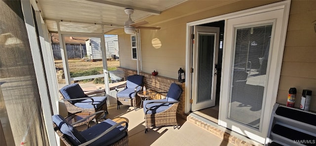 view of patio featuring ceiling fan