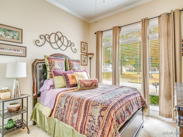 carpeted bedroom with ornamental molding