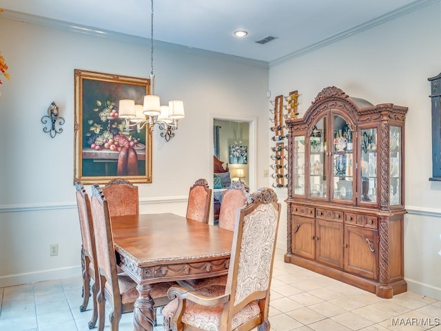 tiled dining space featuring crown molding and a chandelier