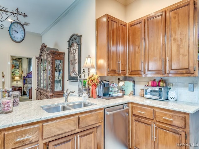 kitchen with sink, crown molding, decorative backsplash, stainless steel dishwasher, and kitchen peninsula