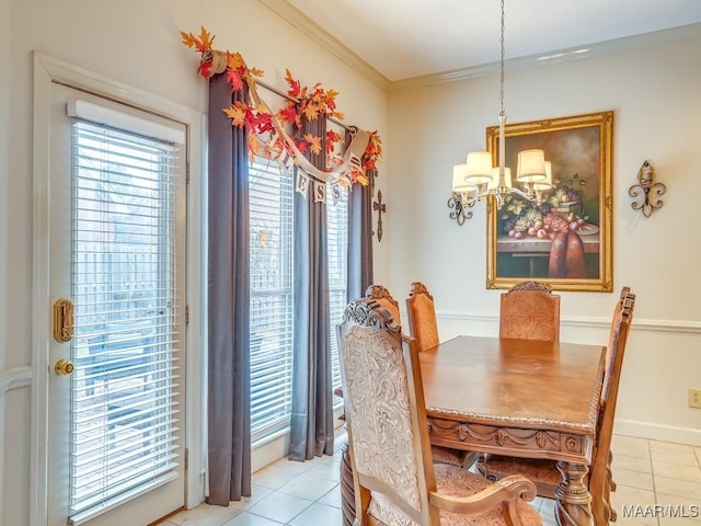 tiled dining space featuring ornamental molding, a wealth of natural light, and a notable chandelier