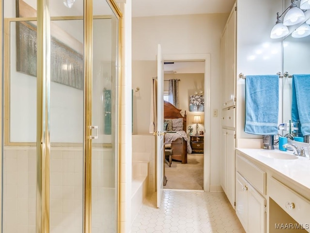 bathroom featuring tile patterned flooring, vanity, and a shower with door