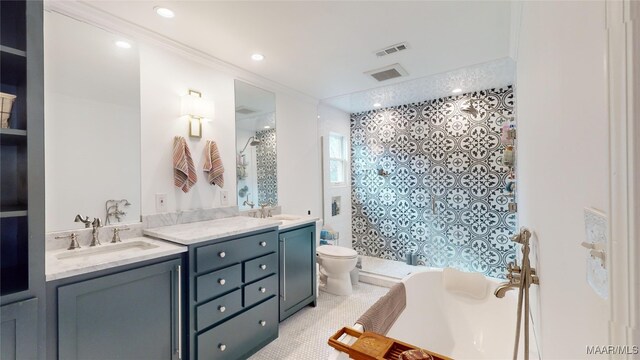 bathroom with a shower with door, vanity, ornamental molding, and toilet