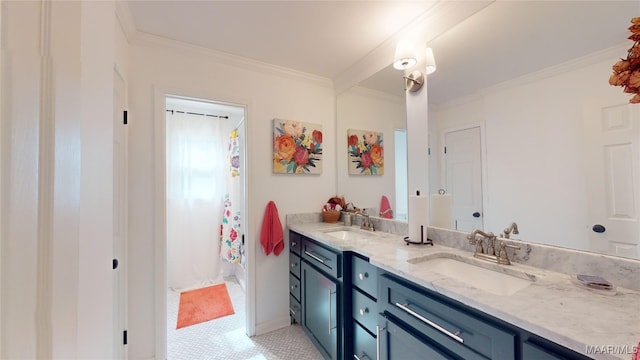 bathroom featuring ornamental molding and vanity