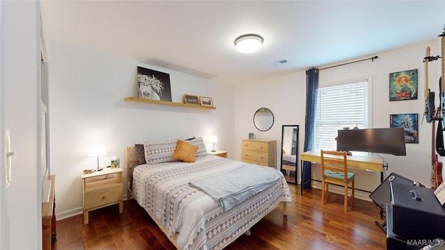 bedroom featuring dark wood-type flooring