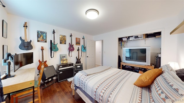 bedroom featuring dark hardwood / wood-style flooring