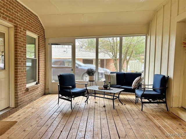 sunroom / solarium with vaulted ceiling