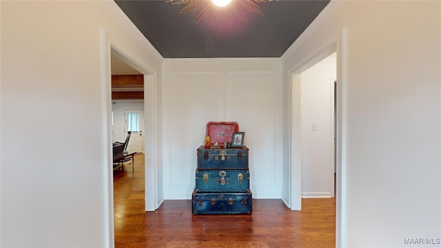 corridor with dark hardwood / wood-style flooring