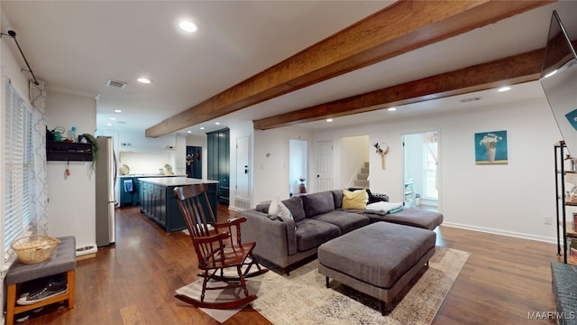 living room with beamed ceiling and wood-type flooring