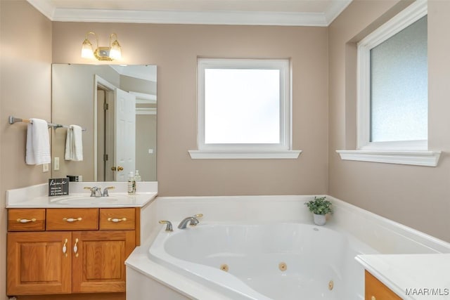 bathroom with vanity, a tub to relax in, crown molding, and a healthy amount of sunlight