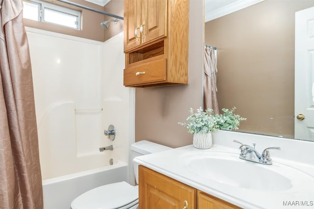 full bathroom with shower / bath combo, vanity, crown molding, and toilet