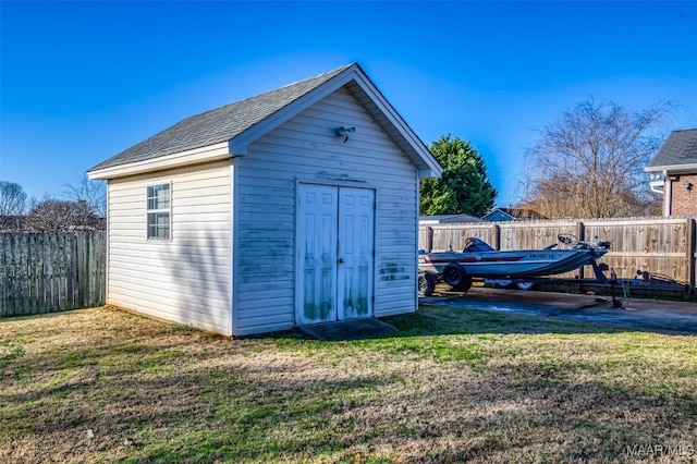 view of outdoor structure featuring a lawn