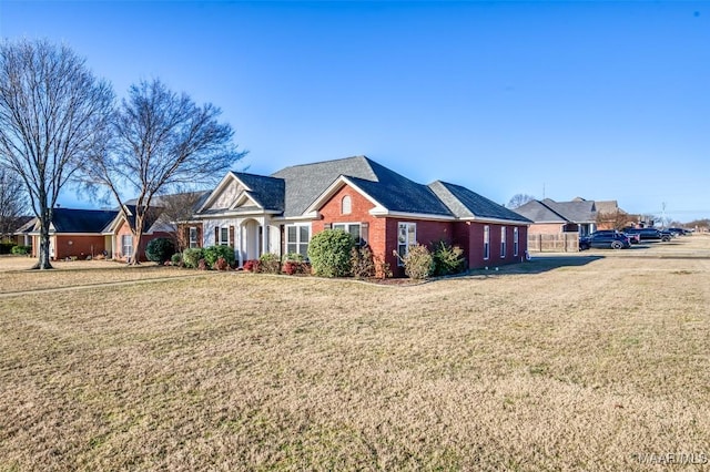 ranch-style house with a front lawn