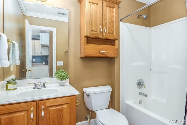 full bathroom with vanity, bathtub / shower combination, crown molding, and toilet