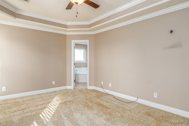 carpeted empty room with crown molding and ceiling fan