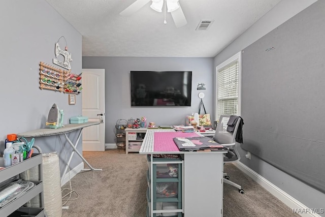 office featuring ceiling fan and carpet