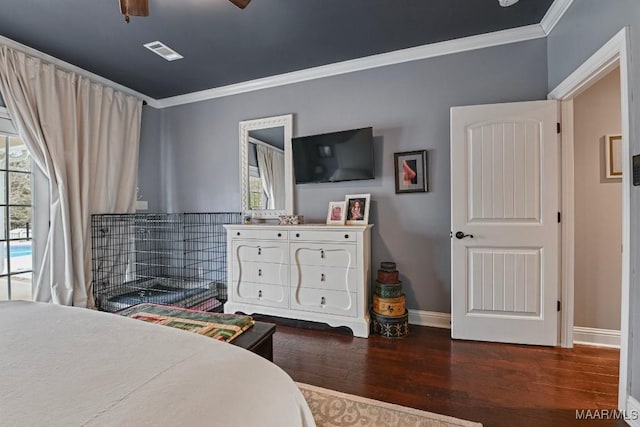 bedroom featuring ornamental molding and dark hardwood / wood-style flooring