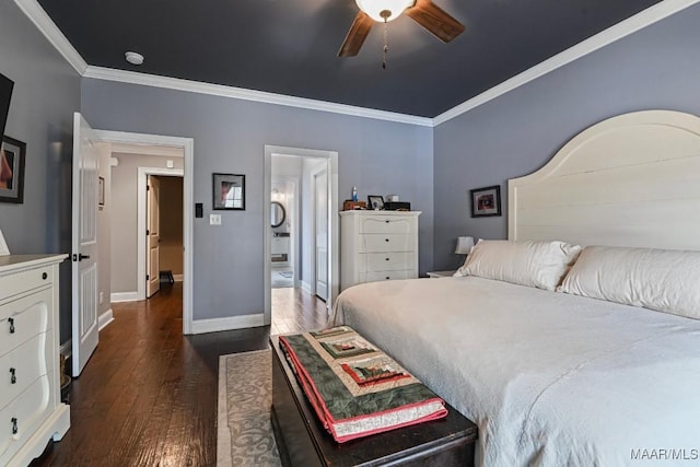 bedroom with crown molding, ceiling fan, ensuite bathroom, and dark wood-type flooring