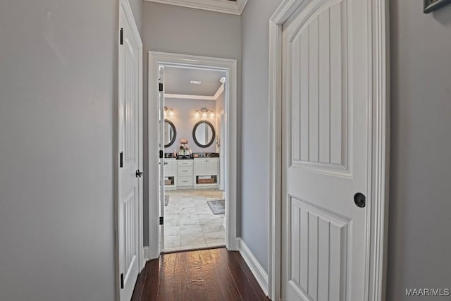 hall featuring dark hardwood / wood-style flooring and ornamental molding