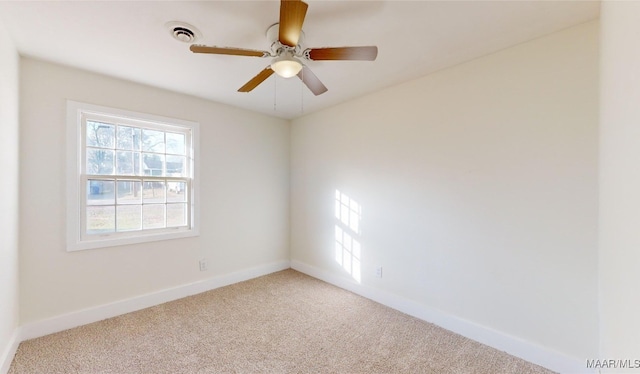 empty room with ceiling fan and carpet flooring