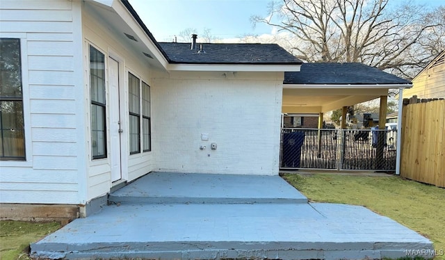 entrance to property featuring a patio area