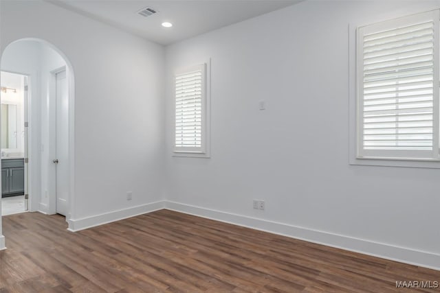 empty room featuring dark hardwood / wood-style floors