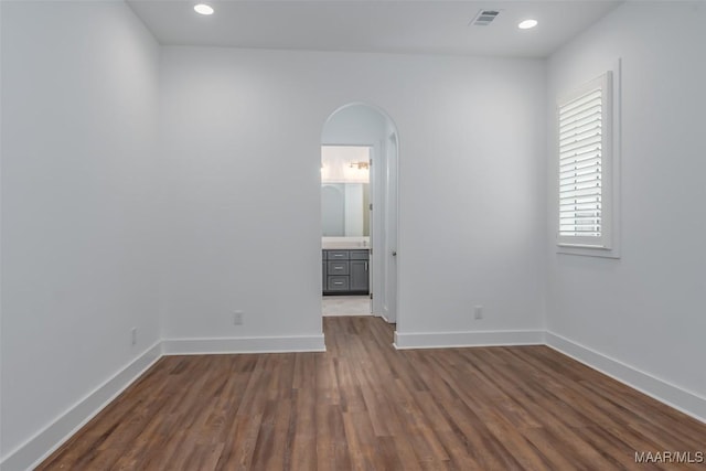 empty room featuring dark hardwood / wood-style floors