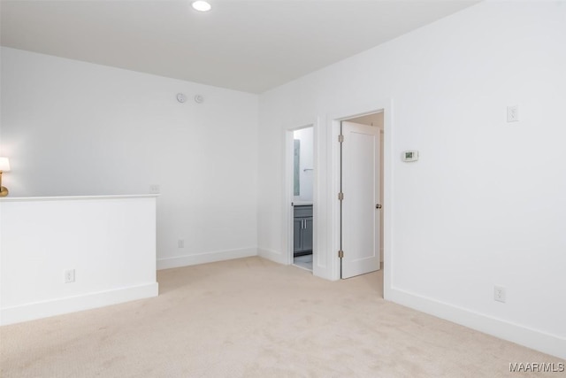 empty room with light colored carpet