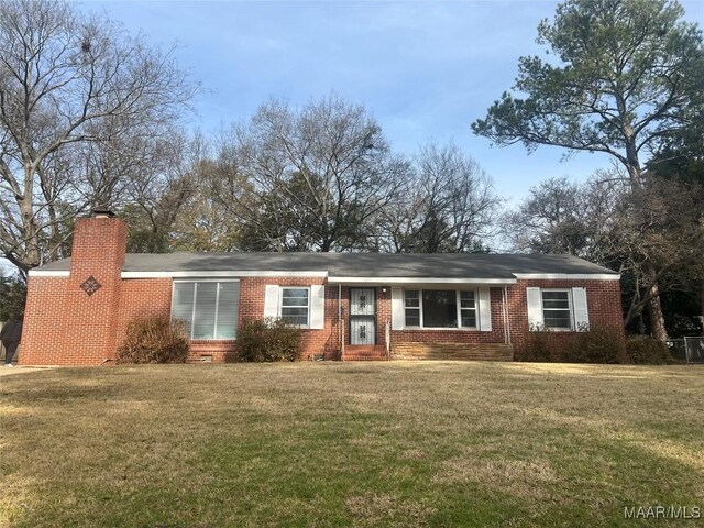 ranch-style home with a front lawn