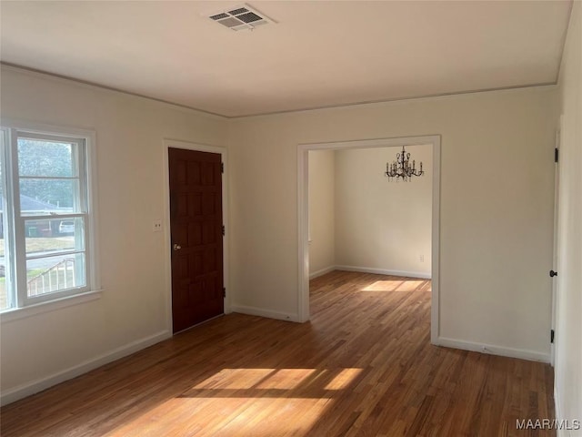 spare room featuring hardwood / wood-style flooring