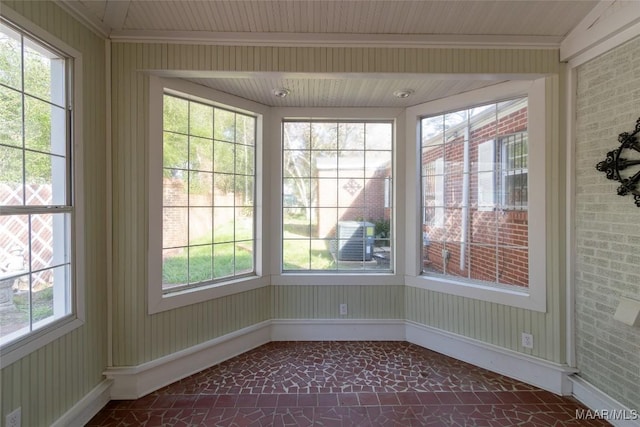 unfurnished sunroom with plenty of natural light