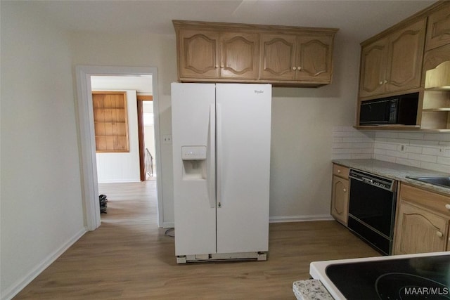 kitchen with baseboards, light wood-type flooring, black appliances, open shelves, and backsplash