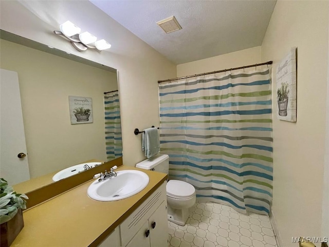 bathroom featuring vanity, a shower with curtain, and toilet