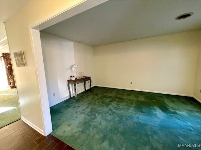 clothes washing area featuring dark carpet