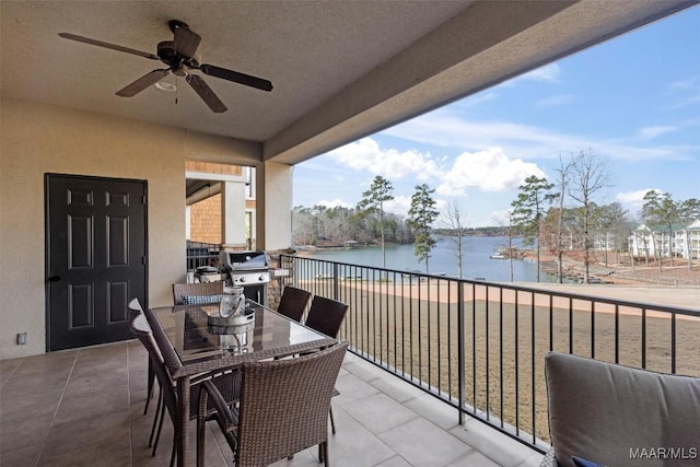 balcony featuring a water view, ceiling fan, and grilling area