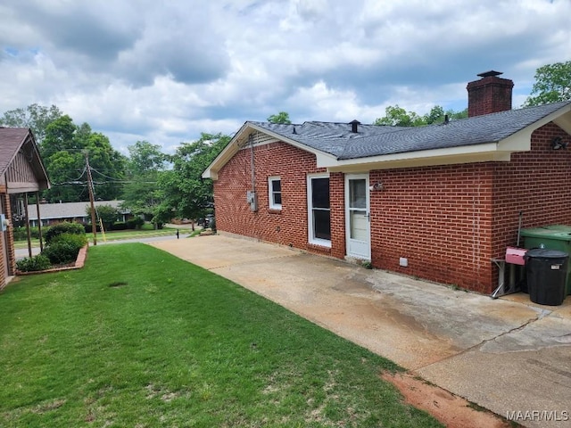 exterior space with a yard and a patio area