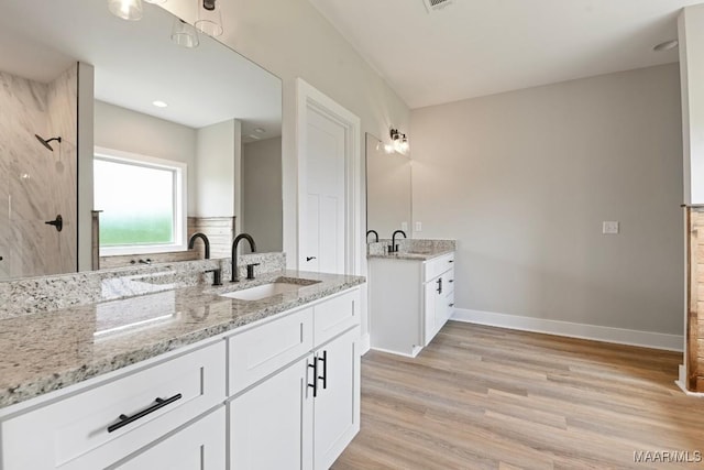 116 Madix Dr, Eclectic, AL 36024 - full bath with wood finished floors and two vanities